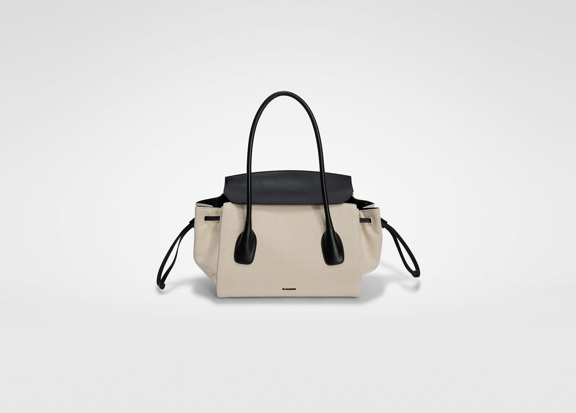 ジルサンダー VOYAGE SMALL。キャンバスとレザーの異素材コンビネーションのハンドバッグ。サイドポケットクロージャー付き